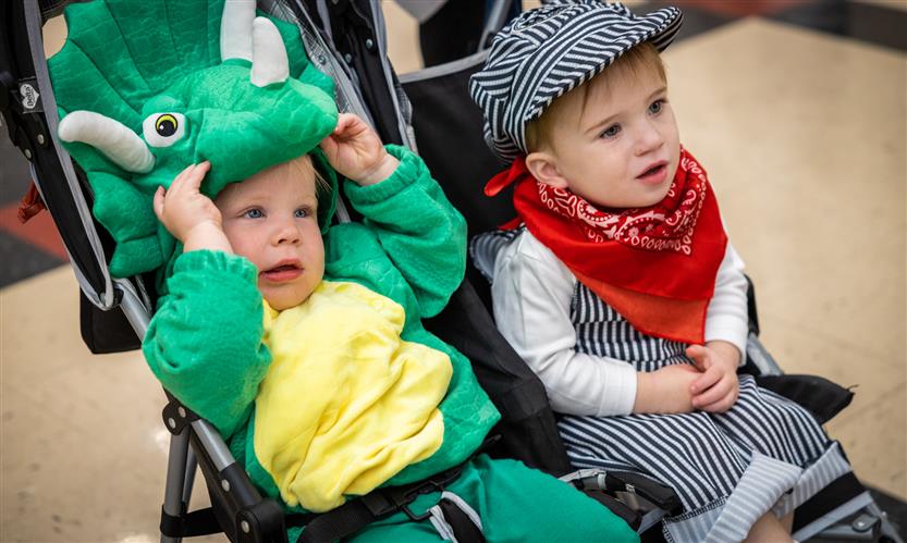 Children in costume trick or treat around school